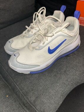Nike White Sneakers with Blue Swoosh and Heel Pull